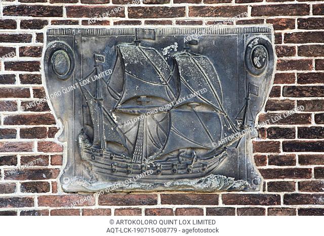 Facing brick with sailing ship within volutes, A sandstone facing brick, on which a sailing ship bounded on either side by volutes