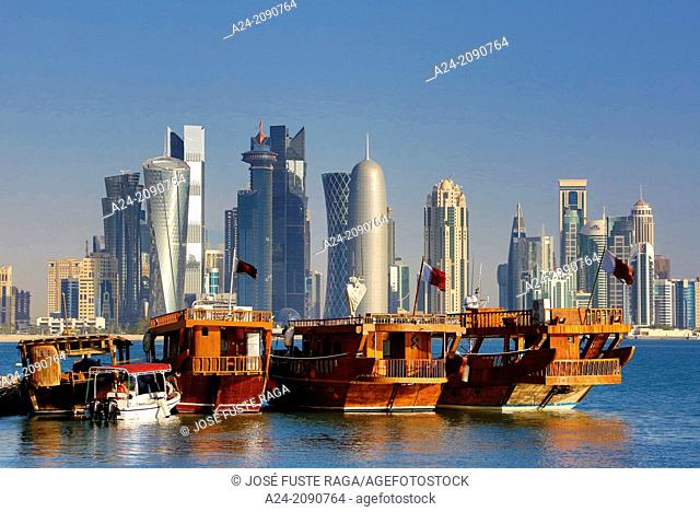 Qatar , Doha City, traditional boats and West Bay Skyline