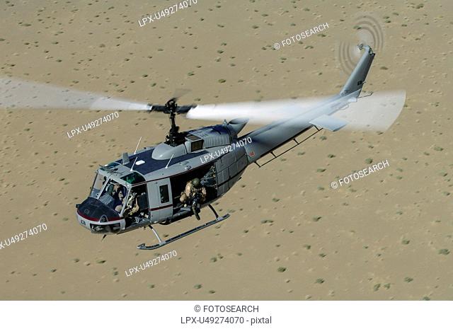 Bell Huey II in flight over the Registan Desert, Afghanistan