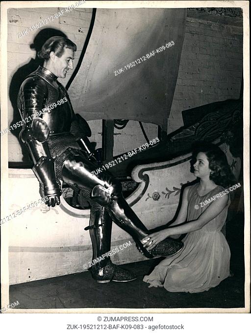 Dec. 12, 1952 - Twelve Year Old Anne Helps 'St. George' On With His Armour: Twelve year old Anne Dilks who comes from Wembley - helps Anton Colin on with his...