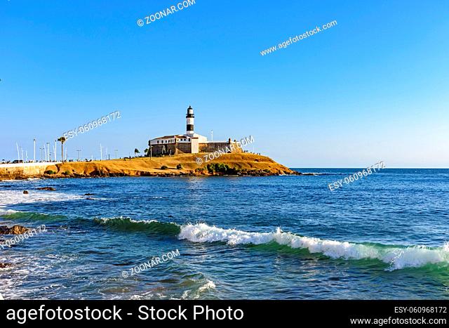 Barra Lighthouse (Farol da Barra) one of the main historical buildings and tourist spot in the city of Salvador in Bahia surrounded by the sea during the late...