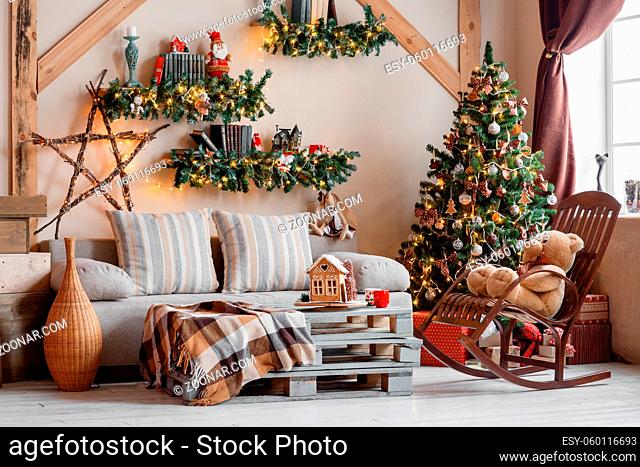 Calm image of interior modern home living room decorated christmas tree and gifts, sofa, table covered with blanket