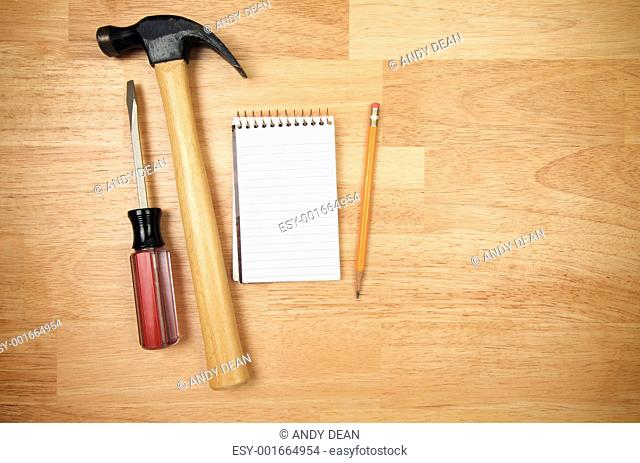 Pad of Paper, Pencil, Hammer and Screwdriver