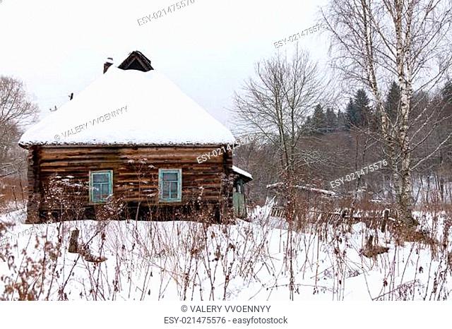 snow covered wooden rustic house