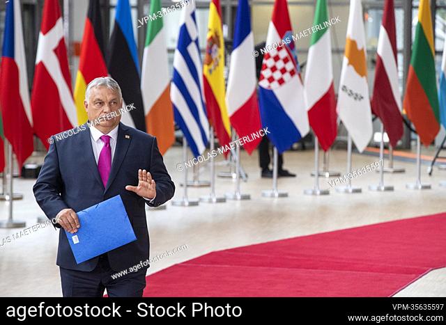 Prime Minister of Hungary Viktor Orban (R) arrives for a special meeting of the European council, at the European Union headquarters in Brussels