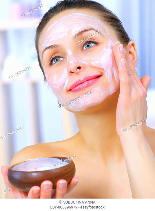 Beautiful Woman Applying Natural Homemade Facial Mask