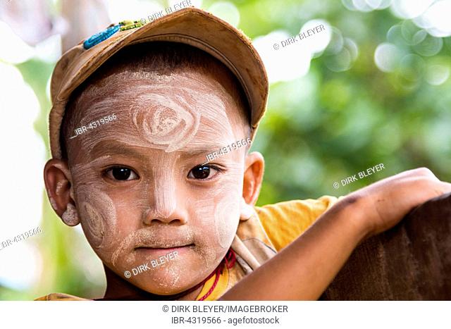Child with Thanaka paste in the face of mountain tribe or mountain people Pa-O or Pa-Oh or Pao or Black Karen or Taungthu or dew-soo, ethnic minority, portrait