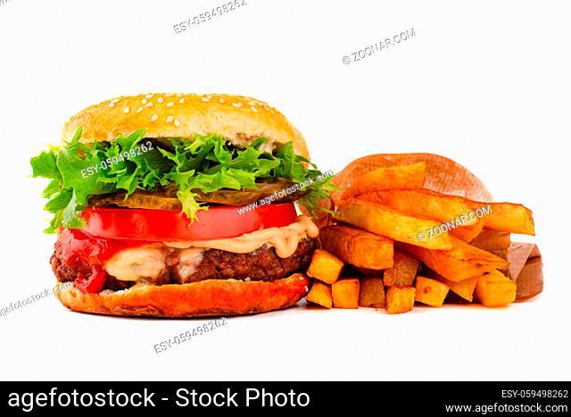 One big tall classic hamburger burger cheeseburger with french fries isolated on white background