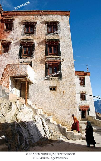 A monk walking up the stairs to his residence at Likir monastery  Likir, Ladakh, India
