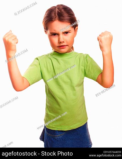 Angry child evil girl shows fists experiencing anger and isolated on white background