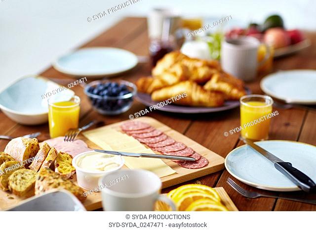food on served wooden table at breakfast