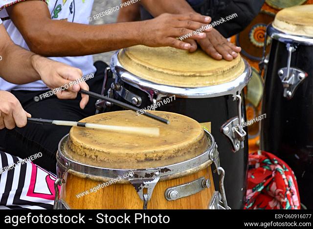 Percussion instrument called atabaque being played in traditional Brazilian samba party