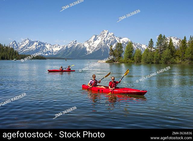 People kayaking in Colter Bay on Jackson Lake in the Grand Teton National Park, Wyoming, United States