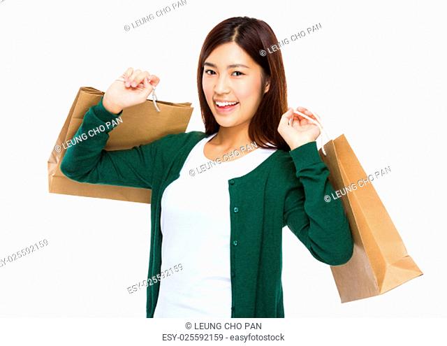 Thrilled woman with shopping bag