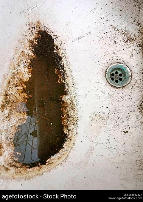 Grunge and dirty ceramic wash basin, close image