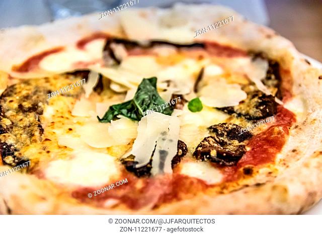 Vegetables pizza in restaurant. Close up shot with narrow depth of field