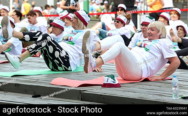 RUSSIA, MOSCOW - JULY 4, 2023: Senior citizens take part in a sports event held in Krymskaya Embankment in Muzeon Park as part of the Moscow Longevity project