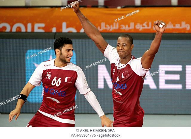 Qatar's Hamad Madadi (L) and Qatar's Rafael Capote celebrate a goal during the men's Handball World Championship 2015 Round of 16 match between Austria and...