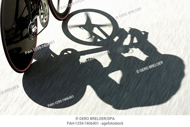 (dpa) - During the first stage of the Tour of Germany cycle race, a 23, 7 km long time trial, the shadow of German cyclist Jan Ullrich (team T-mobile) can be...