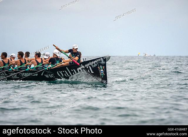 Crew of Kaiku Santurtzi rowing boat in action during XLVI Zarauzko Ikurrina men’s regatta of the ACT League (The Association of Clubs of rowing boats)