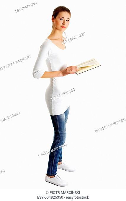 Beautiful female teen with a Bible
