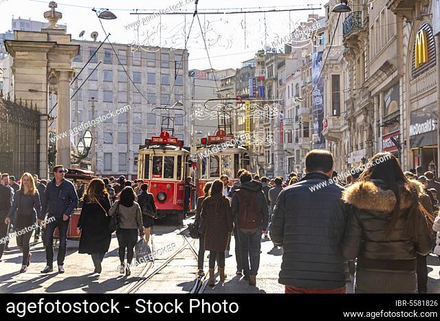 Historic trams between crowds, Istiklal Caddesi, Independence Street, Istanbul, Turkey, Asia