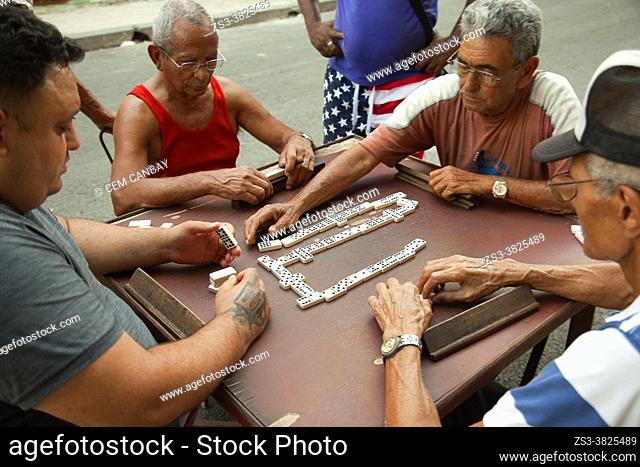 Local people playing domino at the street in Center Havana, La Habana, Cuba, West Indies, Central America