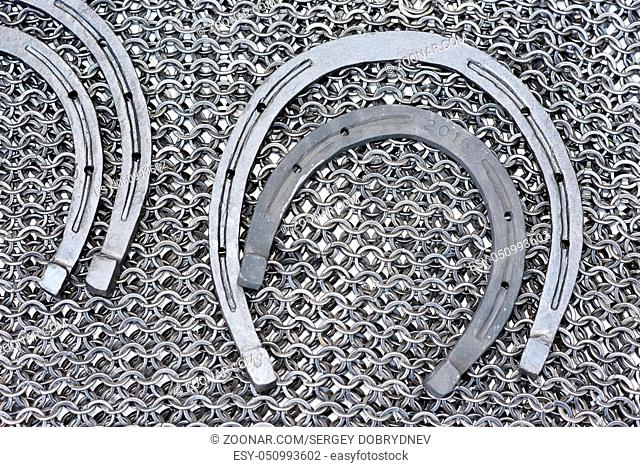 Metal products blacksmith - Military chainmail and horseshoe close-up