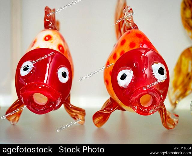 Hand-shaped fish twins blown from stained glass. Artistic object made by the traditional method of Czech glass blowers
