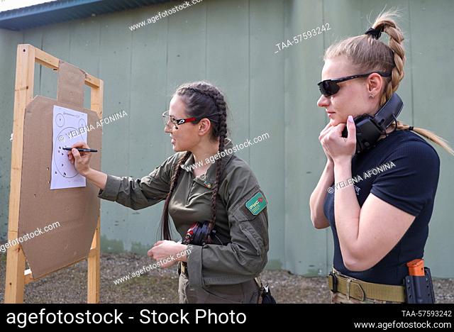 RUSSIA, GUDERMES - FEBRUARY 27, 2023: Women are seen at a shooting range during the ""Female Bodyguard"" close protection course at Russian Spetsnaz University