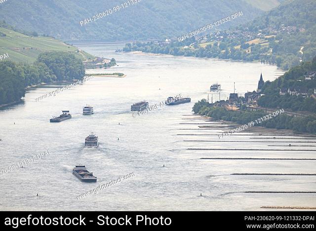 20 June 2023, Rhineland-Palatinate, Bacharach: Freight and passenger ships sail on the Rhine. Photo: Boris Roessler/dpa. -...