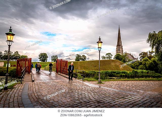 Copenhagen, Denmark - August 10, 2016. People is walking in Churchill Park in Copenhagen, Denmark, a rainy day of summer