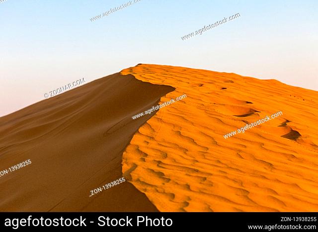 Beautiful yellow sand dunes. The desert of India. Desert at sunset Golden waves of sand in the desert