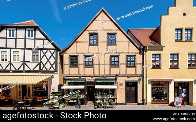 Germany, Saxony-Anhalt, Tangermünde, half-timbered houses in the historic old town, flower shop, baker, ice cream parlor