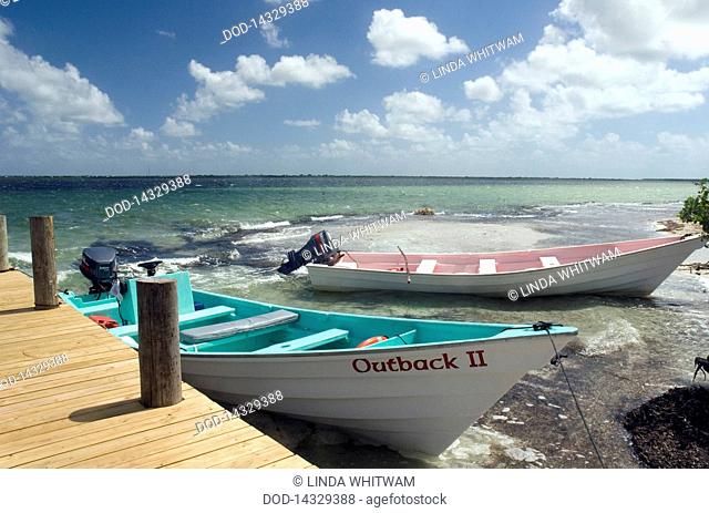 Caribbean, Leeward Islands, Barbuda, Codrington Lagoon, View of boat moored by jetty