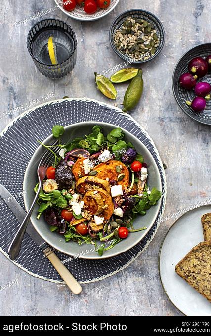 Watercress salad with beetroot, sweet potatoes, tomatoes and feta