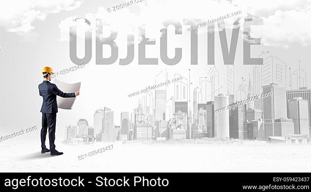 Young businessman with hard hat and OBJECTIVE inscription, new business opportunity concept