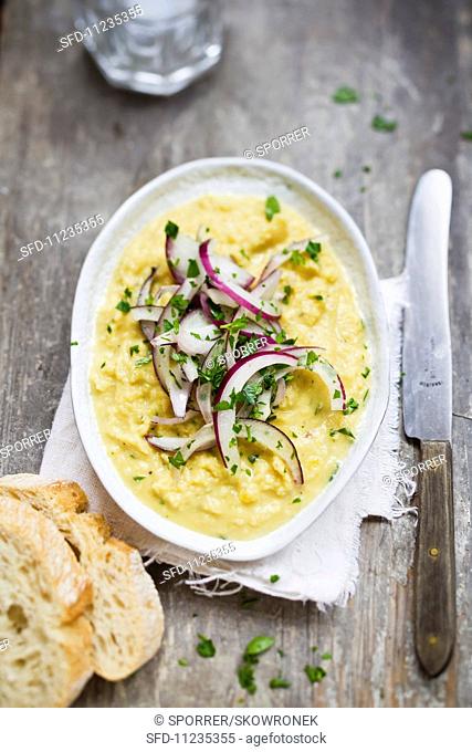 Yellow lentil puree with red onions