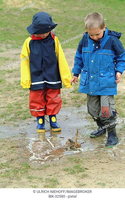 Children play in sludge