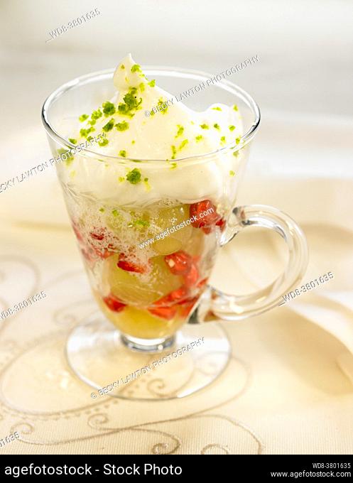 Cava mousse with grapes, pomegranate, cream and pistachios