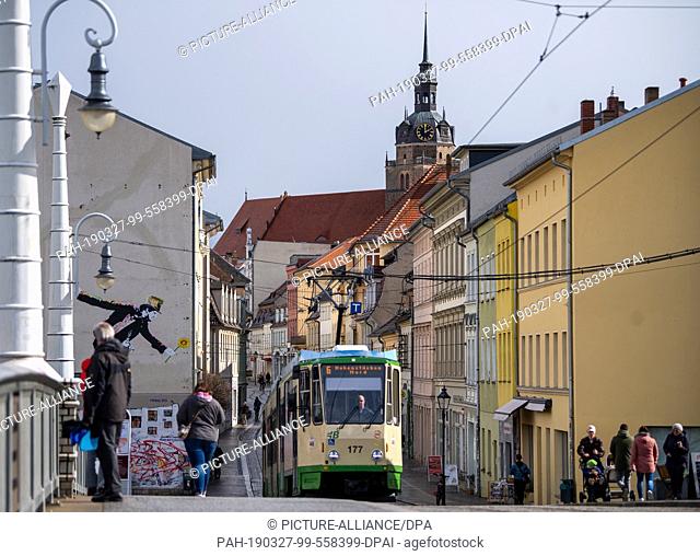 25 March 2019, Brandenburg, Brandenburg an der Havel: A tram line 6 runs along the main road in the direction of the Old Town