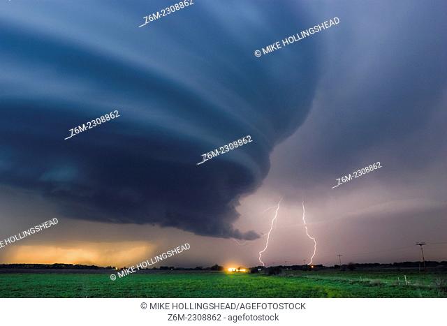 Striated supercell passes just north of Grand Island Nebraska May 10, 2005 producing large hail and lightning during twilight