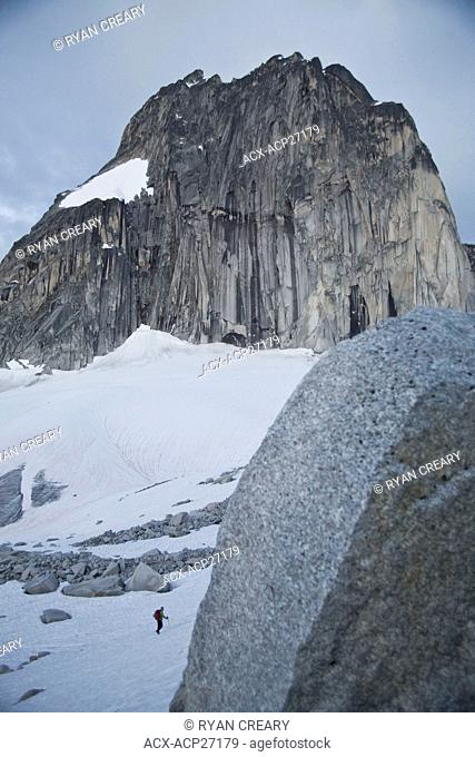 Two female climbers hike towards Bugaboo/Snowpatch Col in Bugaboo Provincial Park, BC