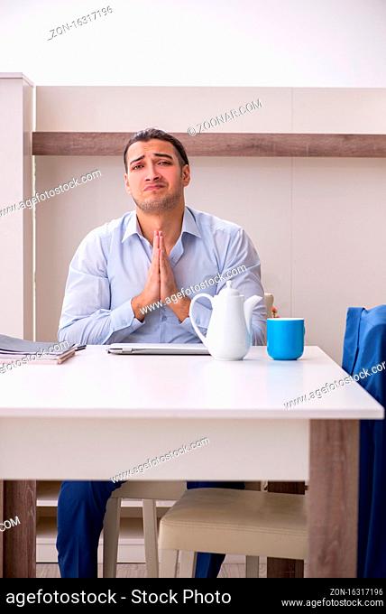 Male employee working from the house