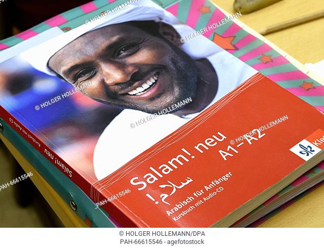 Language books lying on a table at an Arabic course at the Wilhelm-Raabe school in Hanover, Germany, 25 February 2016. Many people participate in order to...