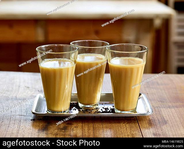 ayurvedic cuisine, three glasses of Golden Chai tea with milk or oat milk