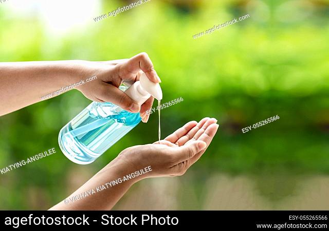close-up cleaning hand using alocohol gel waterless in pump bottle, disinfection for safety prevent and protect from infection of virus and germ Covid-19...
