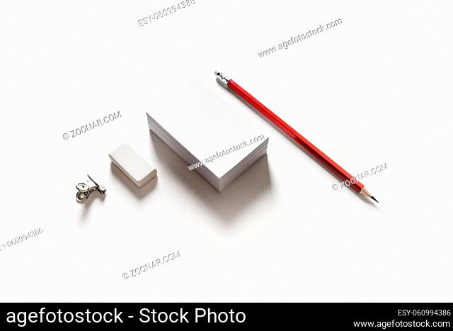 Blank stationery set on paper background. Business cards, pencil and eraser