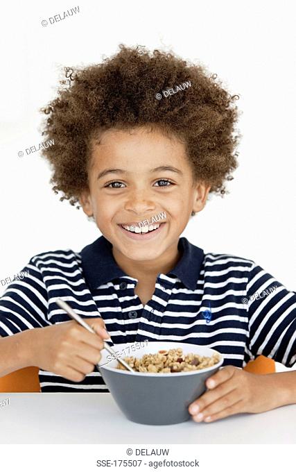 Boy eating a bowl of cereals
