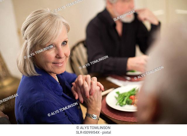 Mature woman at dinner party